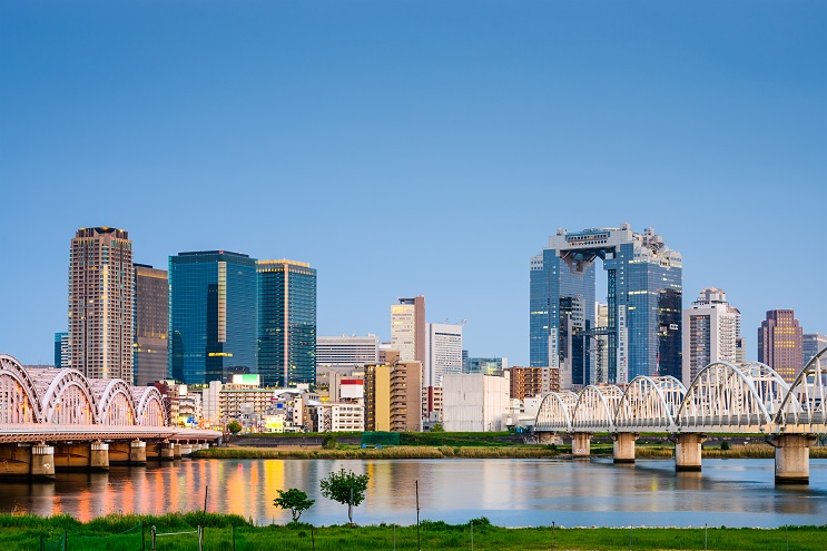 Osaka, Japan skyline at Umeda from across the Yodogawa River.