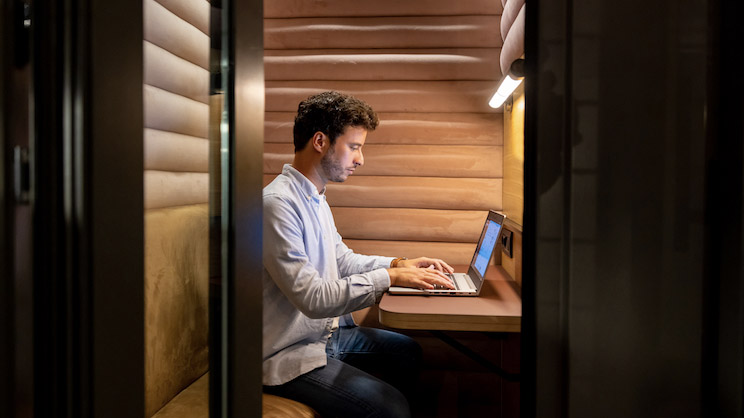 Employee is working on laptop