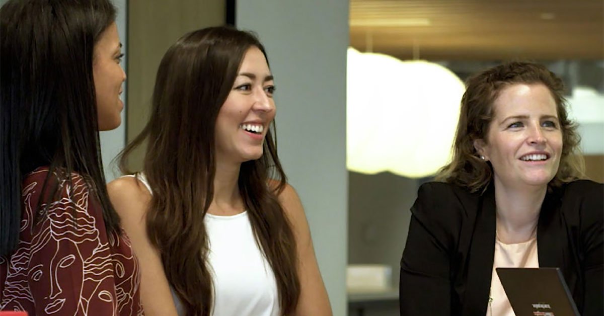 Three women talking in office