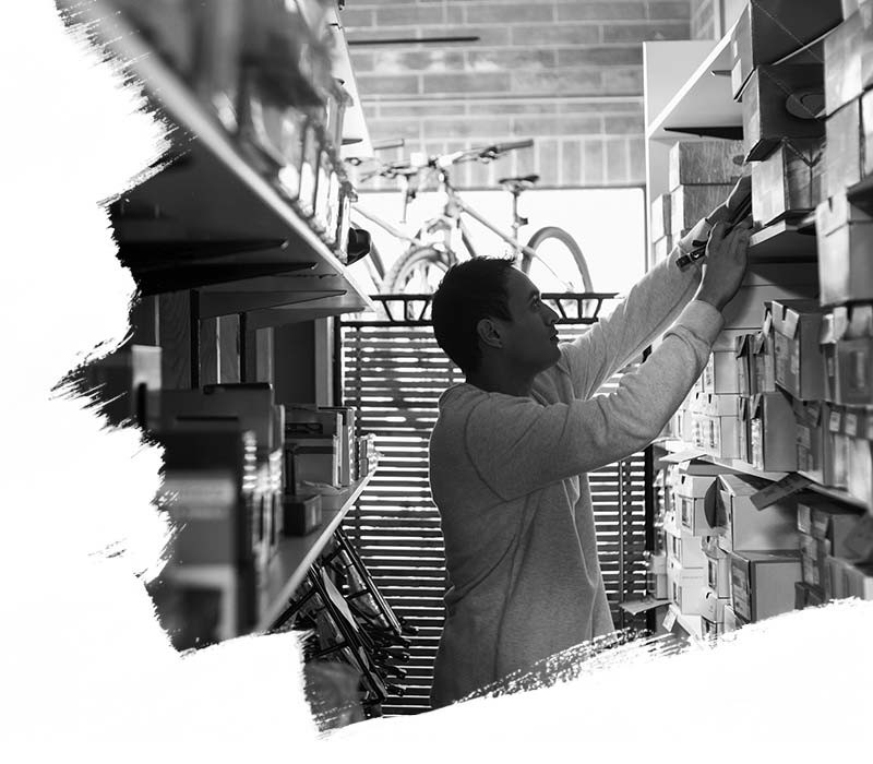 Man warehouse worker checking the goods at logistic warehouse