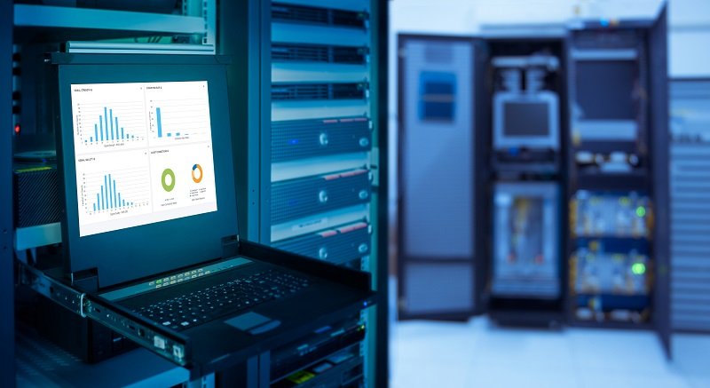 monitor show graph information of network traffic and status of device in server room data center and blur background