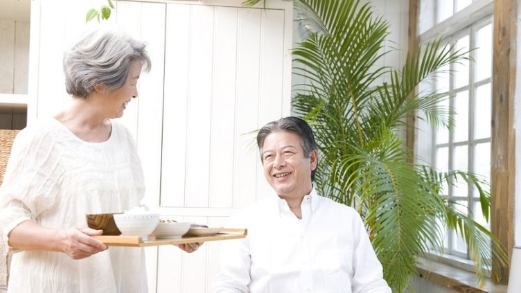A wife carrying a breakfast for her husband